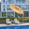 10ft Round Offset Hanging Umbrella-Beige shades two lounge chairs