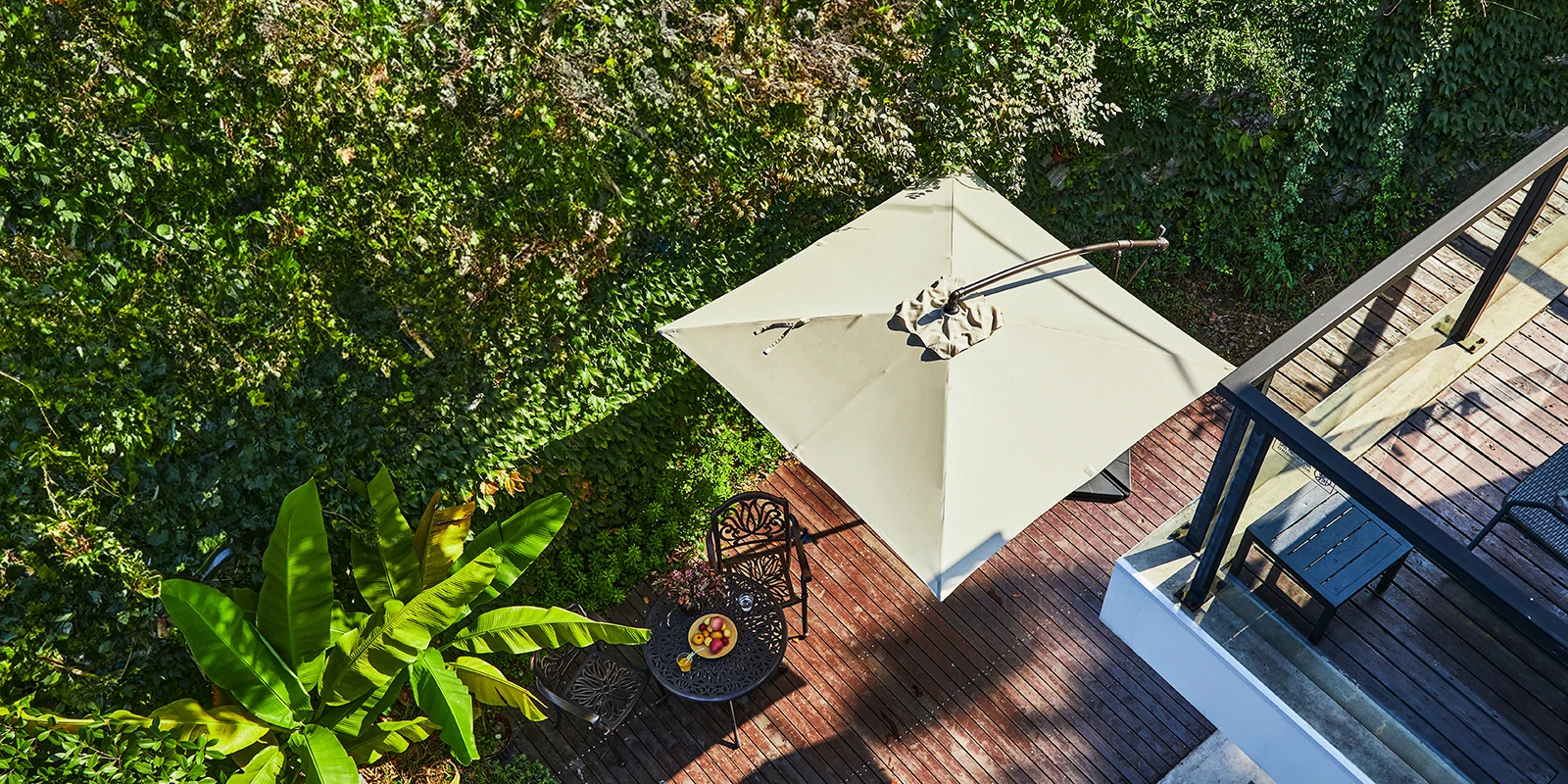 8 x 8 ft Square Offset Hanging Umbrella with Base at Patio