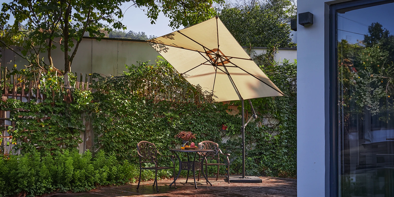 8 x 8 ft Square Offset Hanging Umbrella with Base at back yard