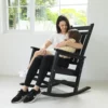 A mom soothing her daughter on the Classic Porch Rocking Chair-Black