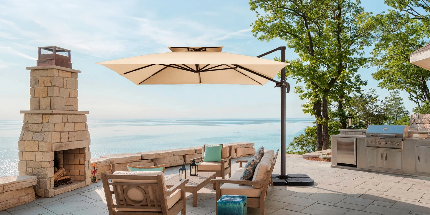 Beige Double Top Square Cantilever Umbrella by the sea