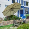 Olefin 10ft Round Auto Tilt Patio Umbrella-Creamy White in the backyard