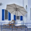 Olefin 10ft Round Auto Tilt Patio Umbrella-Creamy White on the patio