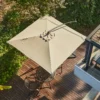 Top view of the 8 x 8ft Square Offset Hanging Umbrella with Base-Beige in the backyard