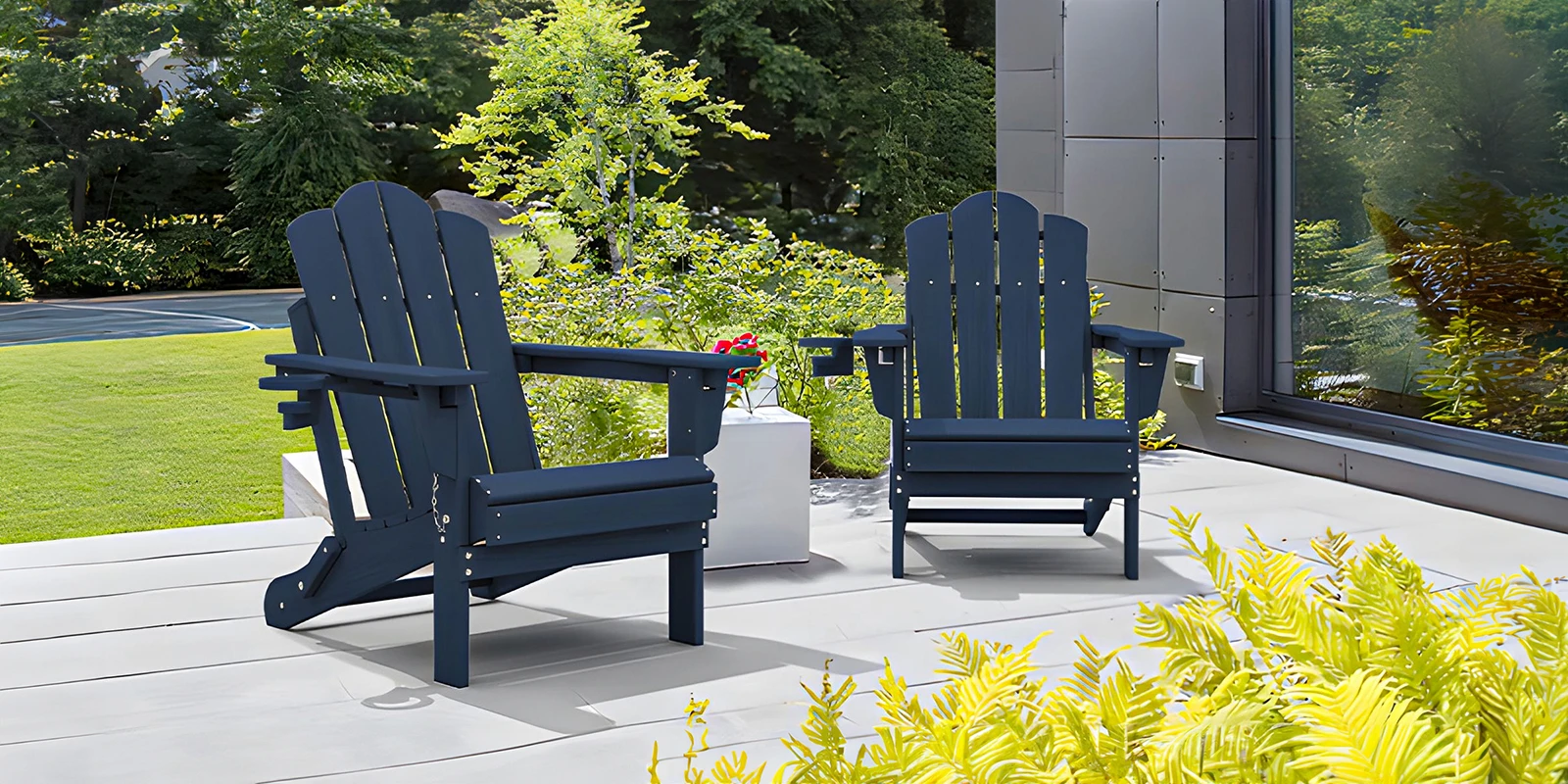 Two blue folding reclining adirondack chairs are placed in the courtyard.