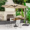 A 10-foot round offset hanging umbrella with a base is placed next to a patio with fruit and drinks.