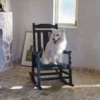 A dog sitting on the Vintage Porch Rocking Chair-Black