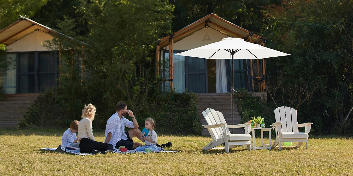 Family enjoy outdoor time with the 7.5ft round tilt patio umbrella