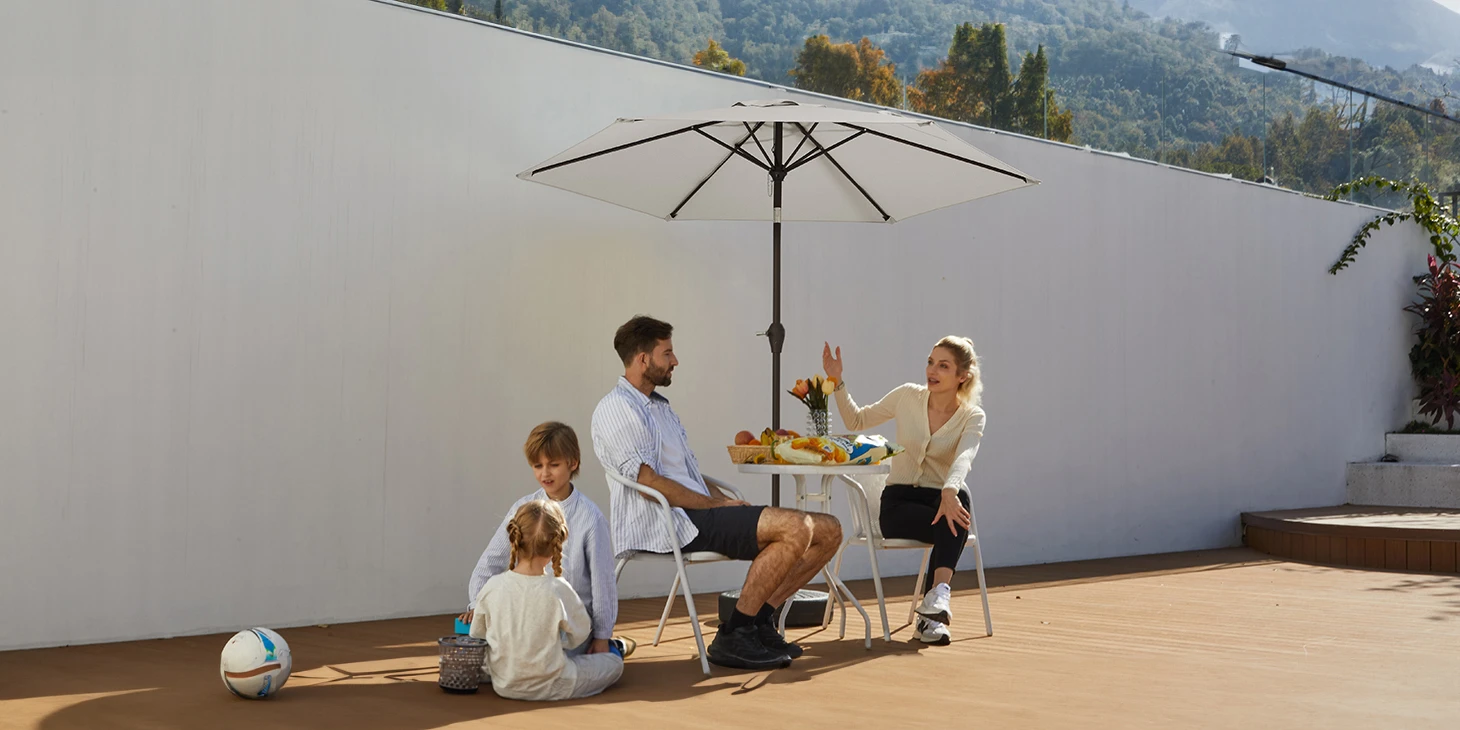 Family enjoy outdoor time with Round Tilt Patio Umbrella (3)