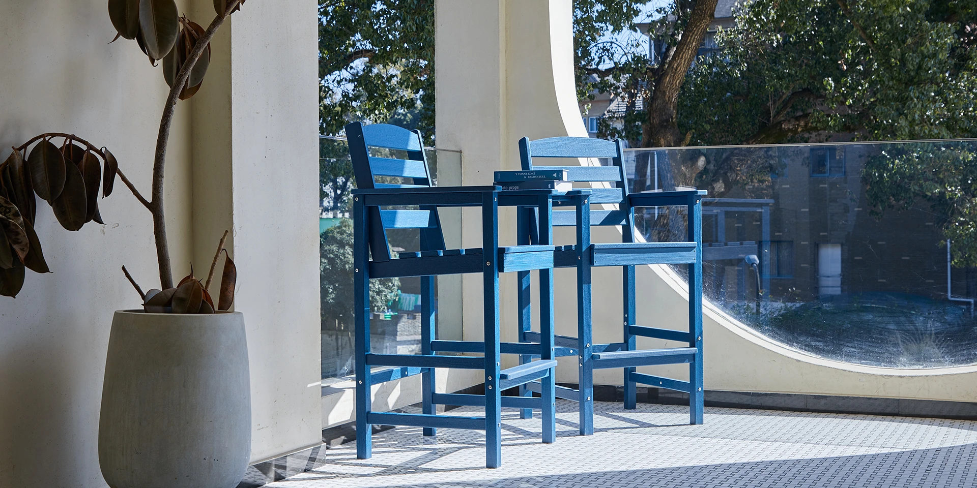 Tete-a-Tete Low Back Bar Arm Chair on the balcony