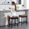 A woman drinking red wine on the 24″ Counter Height Faux Leather Kitchen Bar Stool Set of 2-Dark Brown