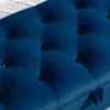 the padded surface of the Bedroom Tufted Velvet Armed Storage Bench-Navy in the bedroom
