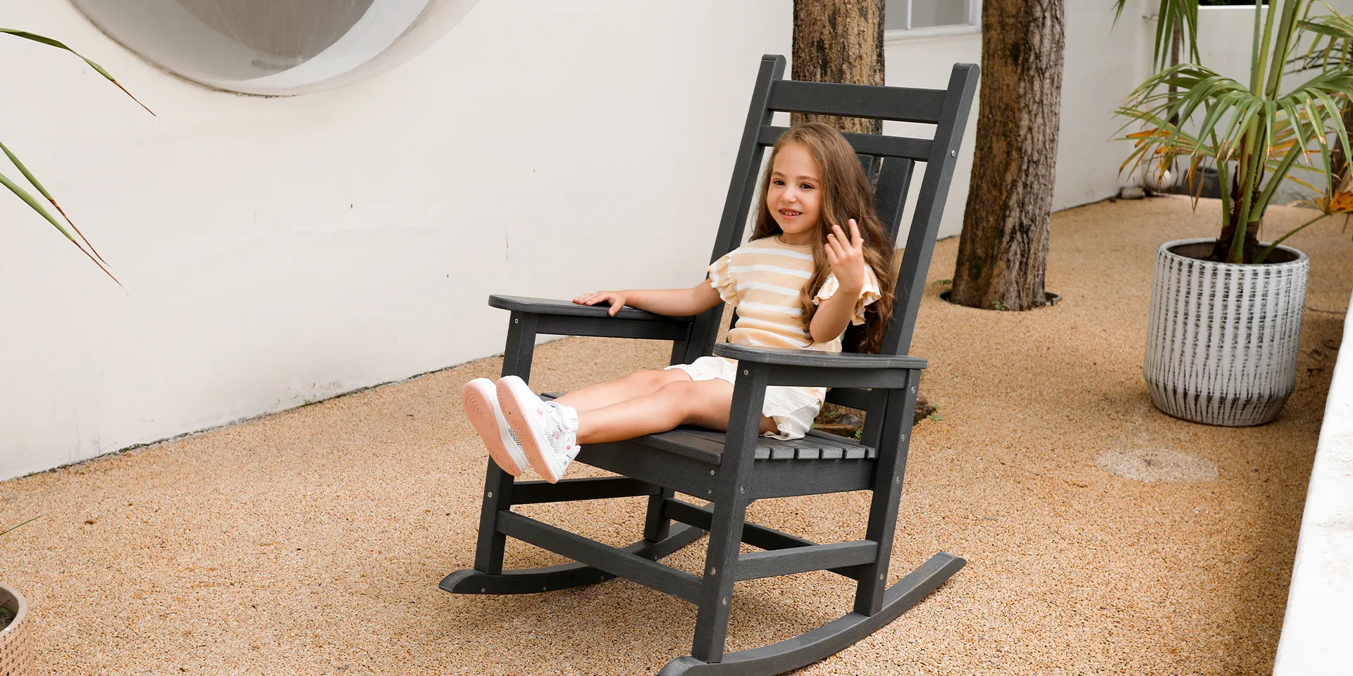 girl sit in the rocking chair